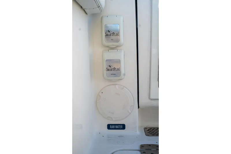 Slide: The Image of SmartPlug outlets and raw water access on 2022 World Cat 400 CC-X boat. - 60