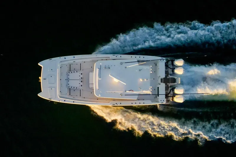 Slide: The Image of Aerial view of 2022 World Cat 400 CC-X boat cruising on water. - 8