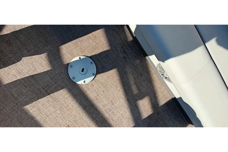 Slide: The Image of 2023 Ranger Reata 223C boat interior with textured flooring and seat detail. - 16