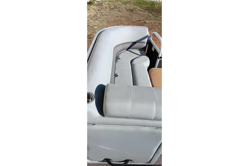 Slide: The Image of 2023 Ranger Reata 223C boat interior with gray seating and cup holder. - 20