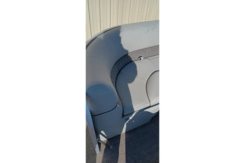 Slide: The Image of 2023 Ranger Reata 223C boat interior with gray cushioned seating. - 31