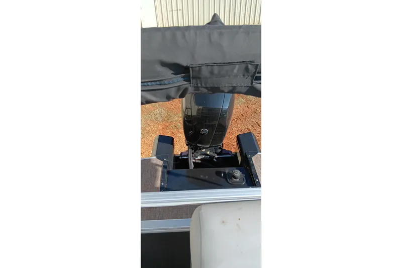 Slide: The Image of 2023 Ranger Reata 223C boat engine view with protective cover. - 36