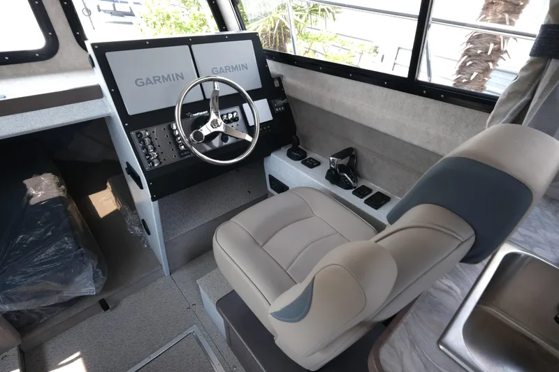 Slide: The Image of Interior of 2026 KingFisher 3025 XRS boat with Garmin navigation system. - 15