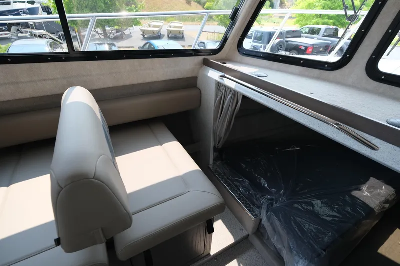 Slide: The Image of Interior of 2026 KingFisher 3025 XRS boat with seating and storage area. - 19