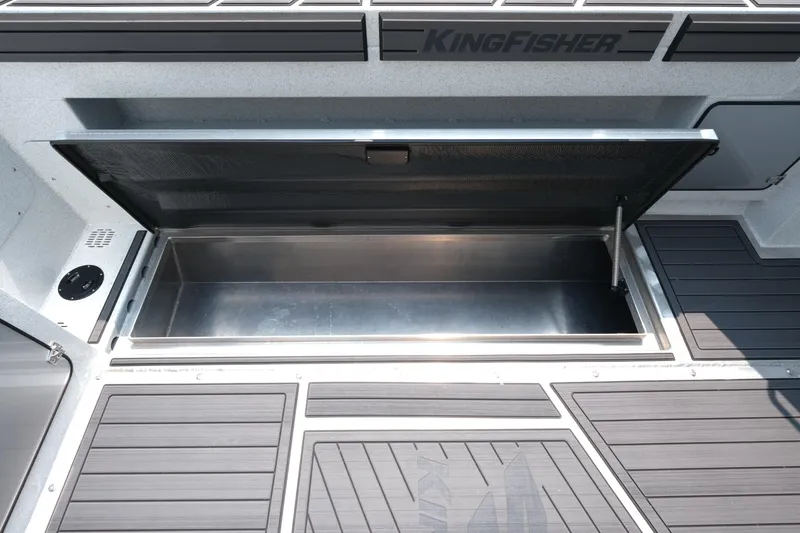 Slide: The Image of Open storage compartment on 2026 KingFisher 3025 XRS boat deck. - 24