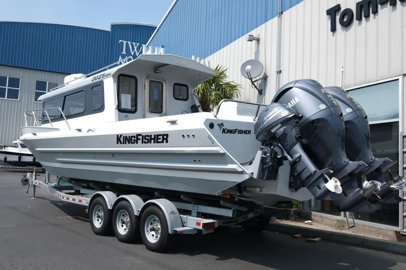 Slide: The Image of 2026 KingFisher 3025 XRS boat with dual Yamaha engines on a trailer. - 4