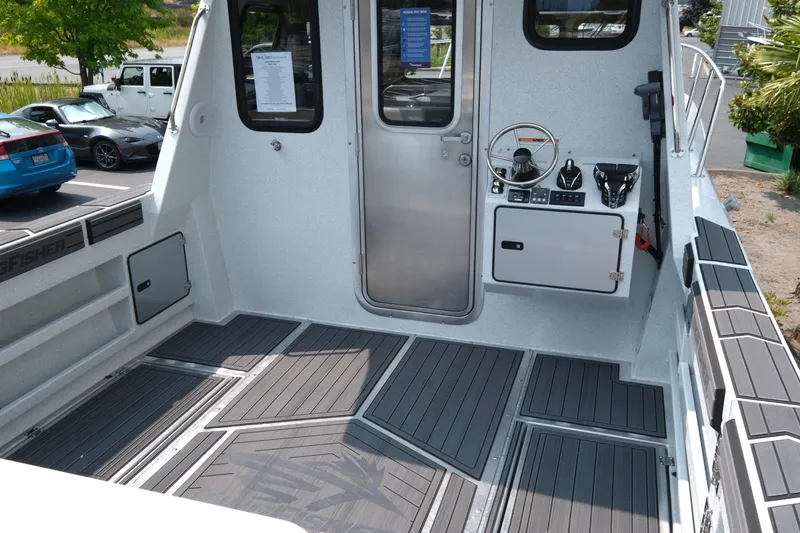 Slide: The Image of Interior of 2026 KingFisher 3025 XRS boat with modern controls and seating. - 6