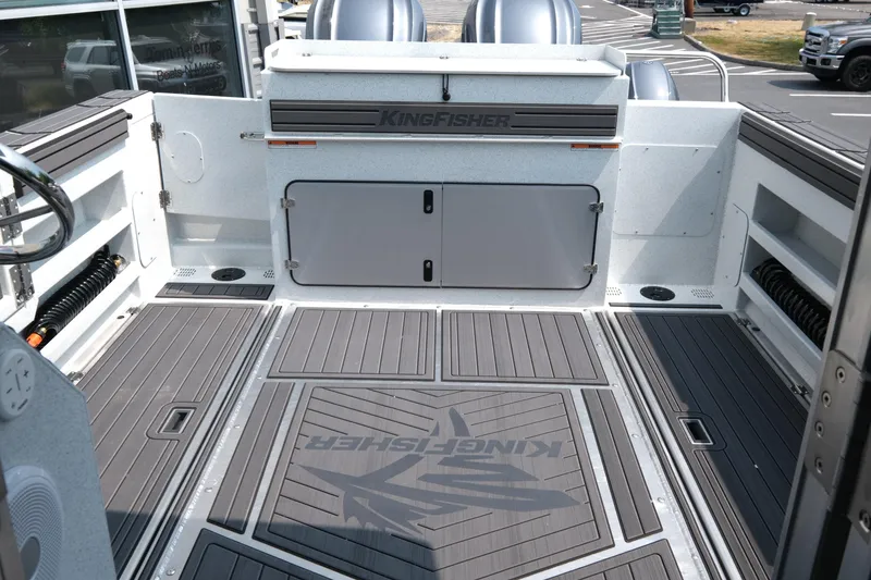 Slide: The Image of 2026 KingFisher 3025 XRS boat deck with sleek design and storage compartments. - 9