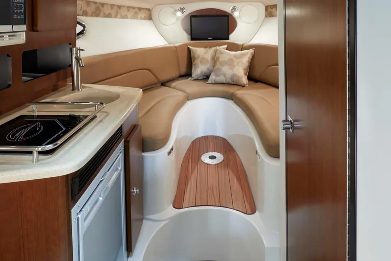 Slide: The Image of Luxurious interior of 2026 Crownline 270 CR boat with cozy seating and kitchenette. - 5