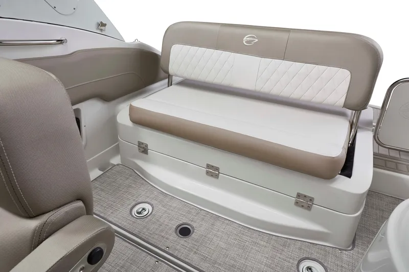 Slide: The Image of 2026 Crownline 270 CR boat interior seating with beige and white upholstery. - 8