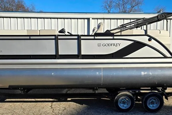 Slide: The Image of 2026 Godfrey Sweetwater 2286 SBC pontoon boat with Mercury engine, parked on trailer. - 10