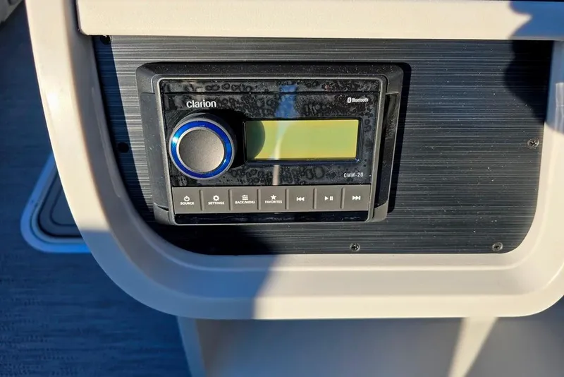 Slide: The Image of 2026 Sweetwater 2286 SBC boat dashboard with steering wheel and control panel. - 6