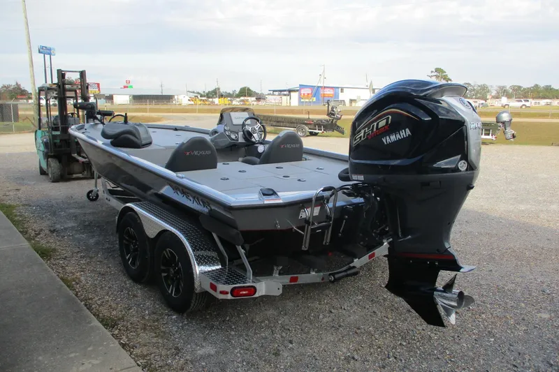 Slide: The Image of 2026 Vexus AVX2080 boat with Yamaha engine on a trailer in outdoor setting. - 2
