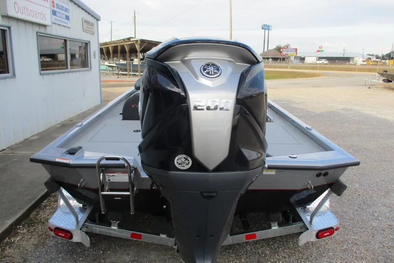 Slide: The Image of 2026 Vexus AVX2080 boat with Yamaha 200 engine, parked outside dealership. - 4