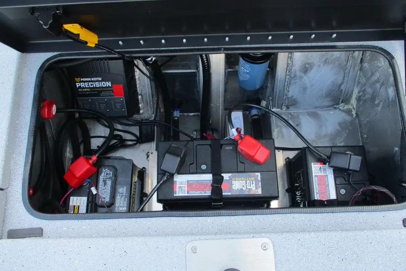 Slide: The Image of Battery compartment of 2026 Vexus AVX2080 boat with Minn Kota Precision charger. - 5