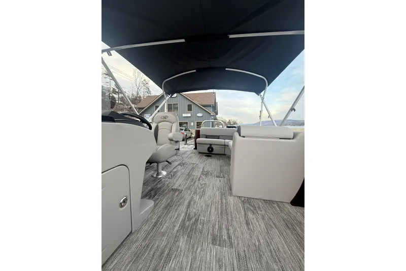 Slide: The Image of 2026 Bentley Pontoons Legacy 200 Cruise XL interior with seating and canopy. - 11