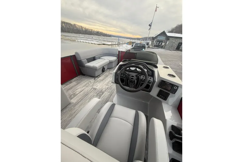 Slide: The Image of 2026 Bentley Pontoons Legacy 200 Cruise XL interior with modern seating and steering console. - 12