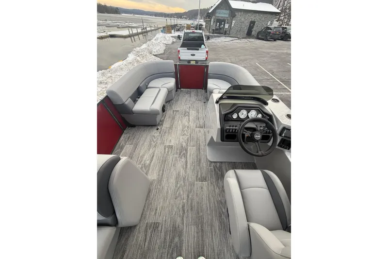 Slide: The Image of 2026 Bentley Pontoons Legacy 200 Cruise XL interior with gray seating and modern dashboard. - 8