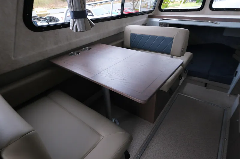 Slide: The Image of Interior of 2026 KingFisher 3025 XRS boat with seating and table. - 10