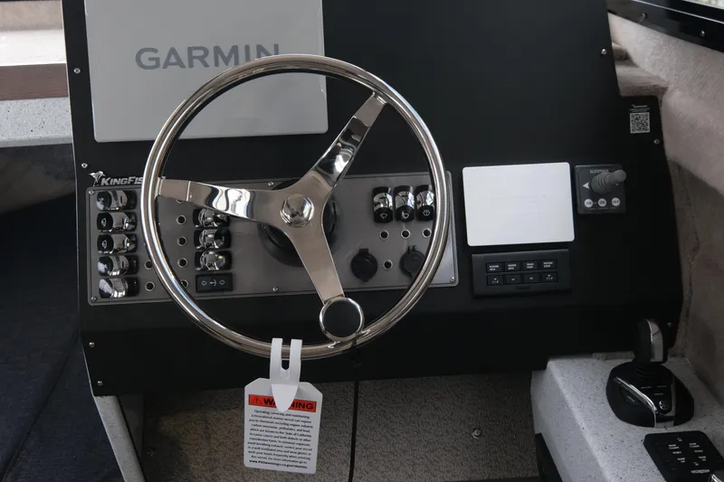 Slide: The Image of Steering console of 2026 KingFisher 3025 XRS boat with Garmin navigation system. - 13
