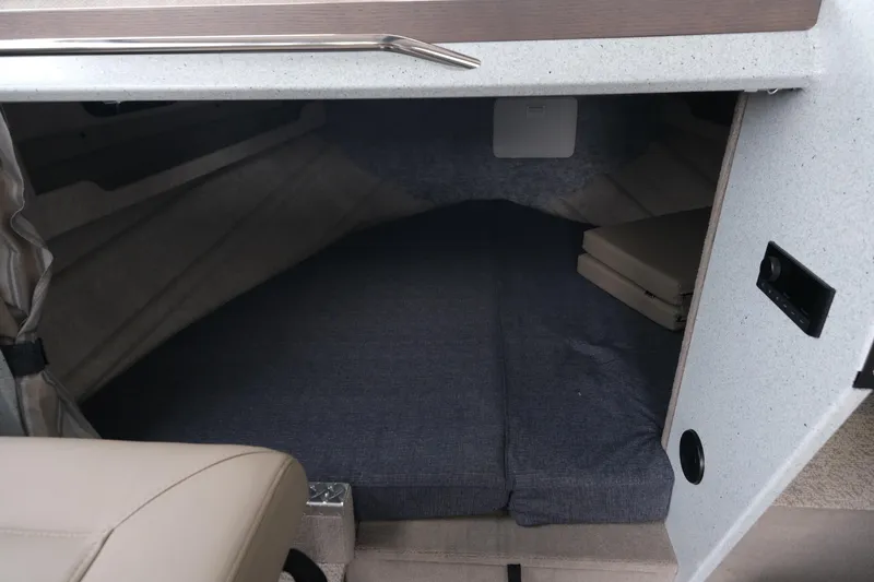 Slide: The Image of Interior cabin view of 2026 KingFisher 3025 XRS boat with cushioned sleeping area. - 15