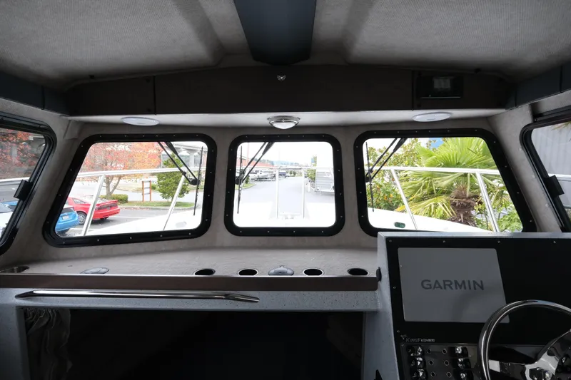 Slide: The Image of Interior view of 2026 KingFisher 3025 XRS boat cockpit with Garmin navigation system. - 16