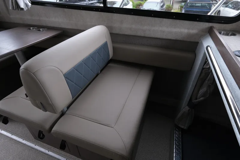 Slide: The Image of Interior seating of 2026 KingFisher 3025 XRS boat with beige upholstery. - 17