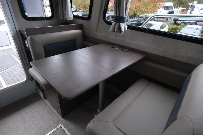 Slide: The Image of Interior of 2026 KingFisher 3025 XRS boat with dining table and seating area. - 18