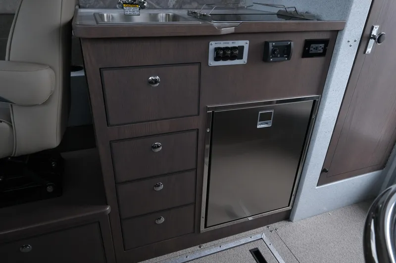 Slide: The Image of Interior of 2026 KingFisher 3025 XRS boat with kitchenette and storage drawers. - 20
