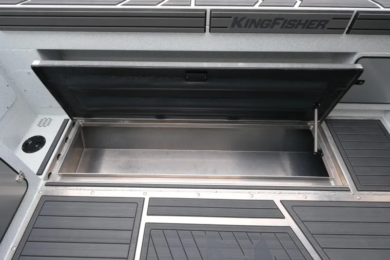 Slide: The Image of Open storage compartment on 2026 KingFisher 3025 XRS boat deck. - 24