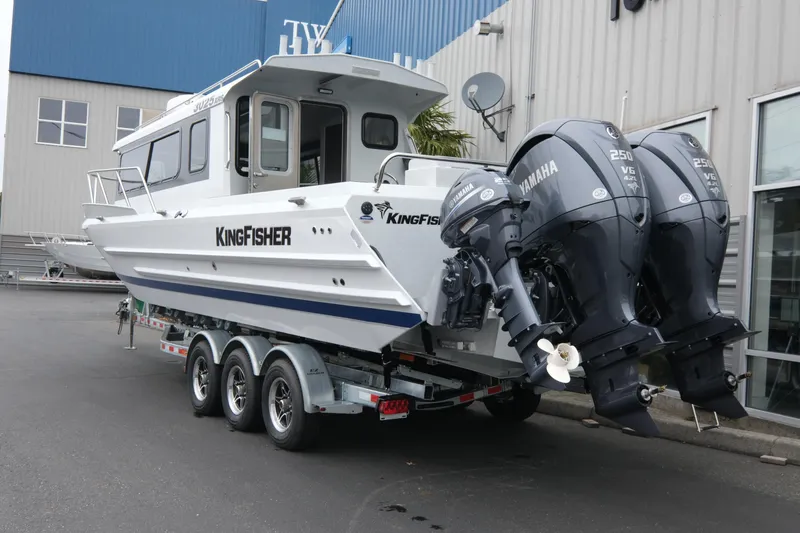 Slide: The Image of 2026 KingFisher 3025 XRS boat with dual Yamaha engines on a trailer. - 4