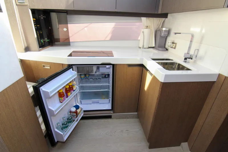 Slide: The Image of Modern kitchen in 2021 Galeon 425 HTS yacht with open fridge and sleek design. - 21
