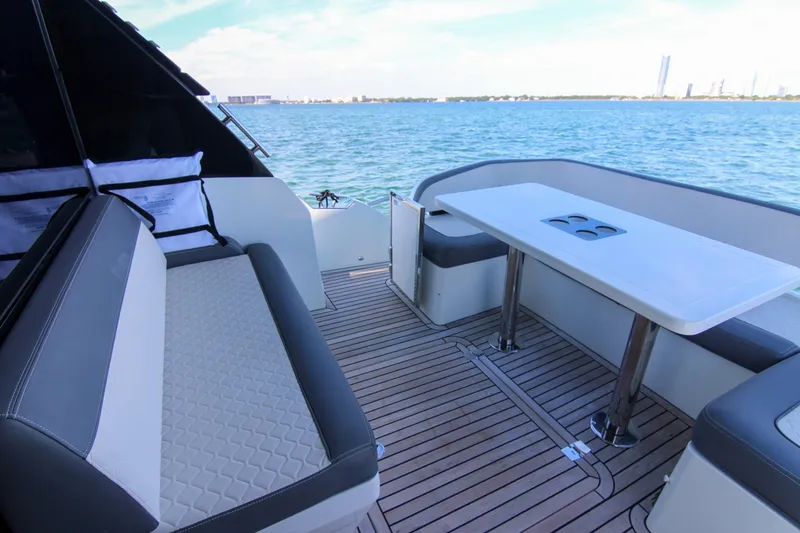 Slide: The Image of Luxury deck of 2021 Galeon 425 HTS yacht with seating and table, overlooking the ocean. - 22