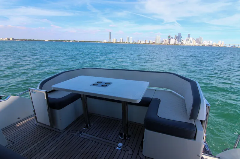 Slide: The Image of Luxury seating area on 2021 Galeon 425 HTS yacht with city skyline view. - 23