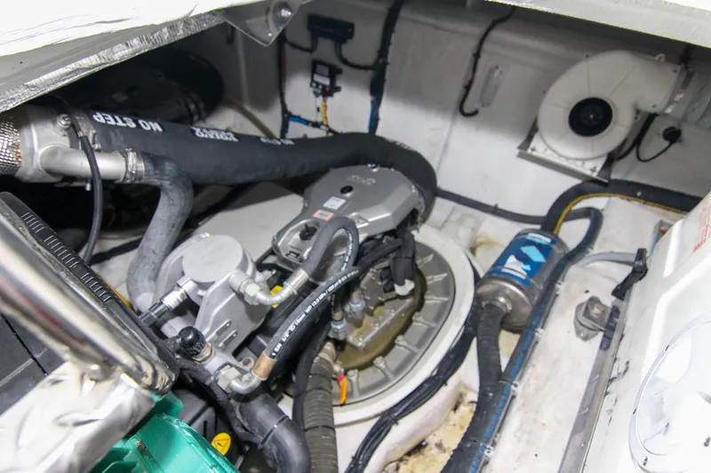 Slide: The Image of Engine room of 2021 Galeon 425 HTS yacht, showcasing mechanical components and hoses. - 26