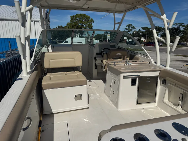 Slide: The Image of Interior view of a 2018 Sailfish 275 DC boat with seating area. - 13