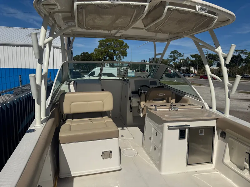 Slide: The Image of Interior view of a 2018 Sailfish 275 DC boat with seating area. - 15