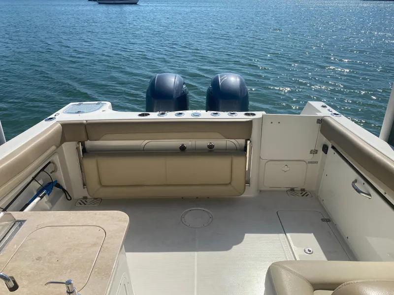 Slide: The Image of Sailfish 275 DC 2018 boat rear with engines on calm water. - 28