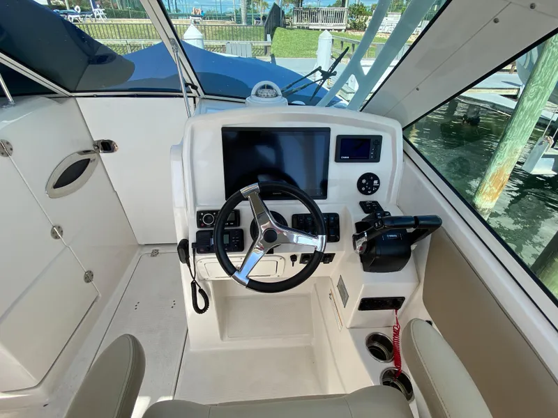 Slide: The Image of 2018 Sailfish 275 DC helm with modern electronics. - 32