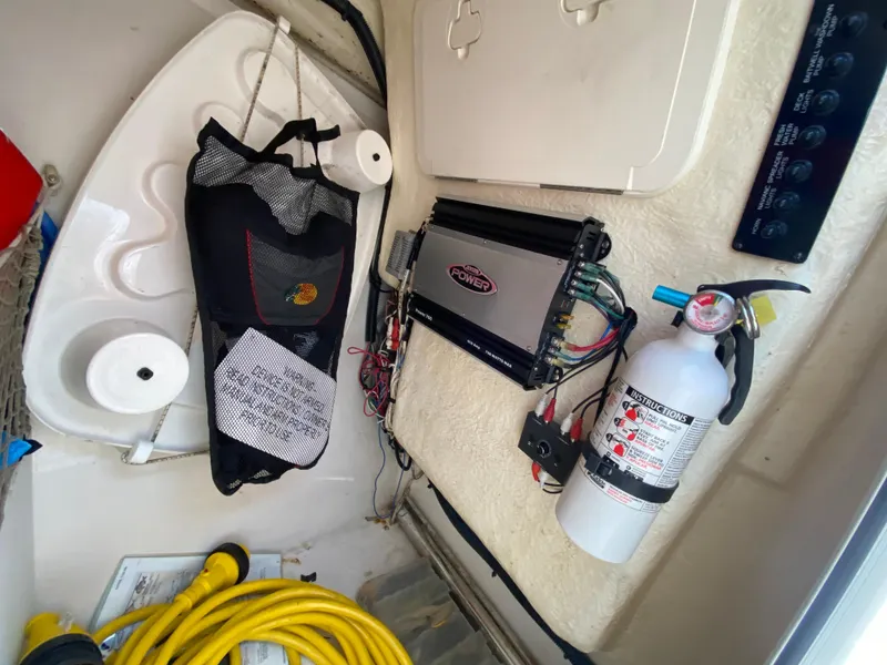 Slide: The Image of Interior of 2018 Sailfish 275 DC with fire extinguisher and cables. - 33