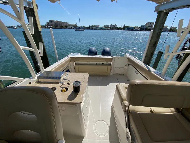 Slide: The Image of Interior view of a 2018 Sailfish 275 DC boat by the water. - 37