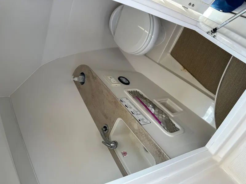 Slide: The Image of Interior of 2018 Sailfish 275 DC featuring toilet and sink. - 40