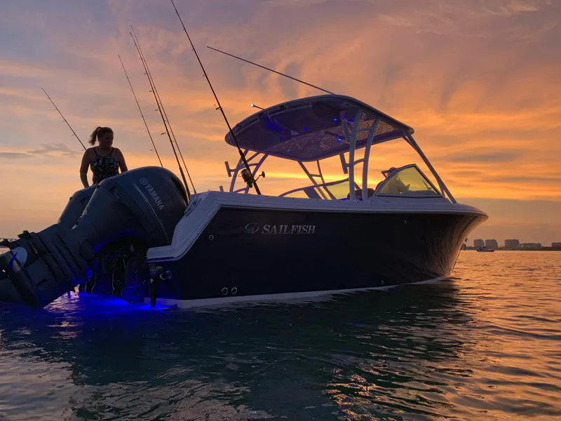 Slide: The Image of Sailfish 275 DC boat on water at sunset, 2018 model. - 42