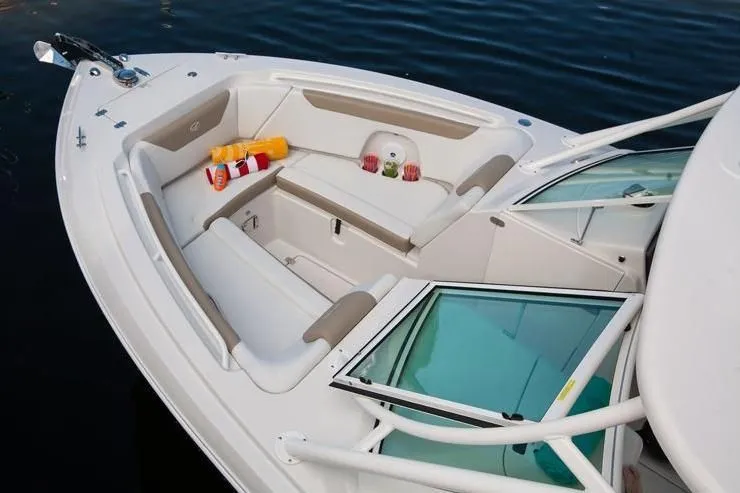 Slide: The Image of 2018 Sailfish 275 DC boat with comfortable seating on calm water. - 47