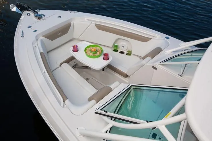 Slide: The Image of Sailfish 275 DC 2018 boat with cozy seating area and table. - 48