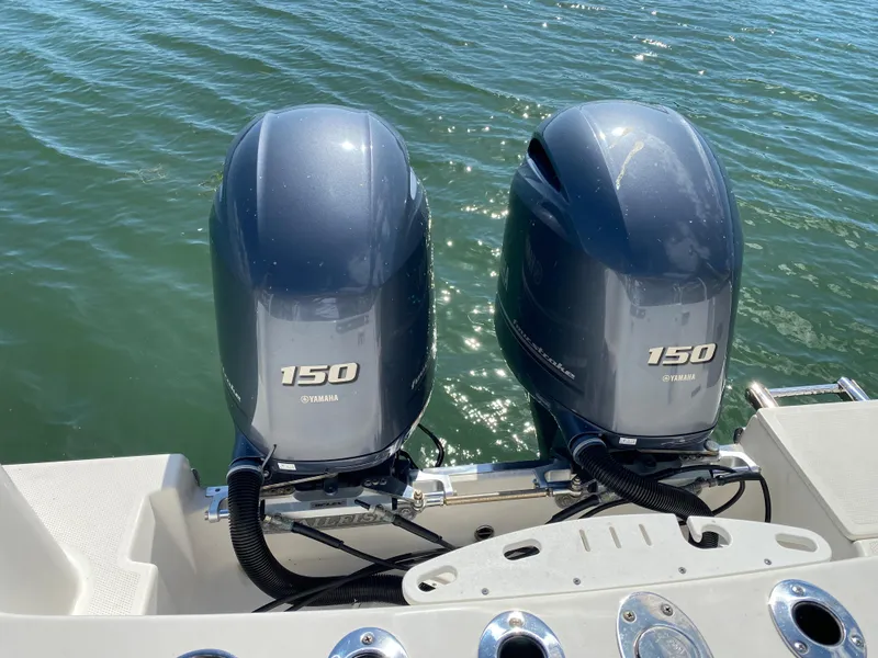 Slide: The Image of Two Yamaha 150 HP outboard motors on a 2018 Sailfish 275 DC boat. - 9