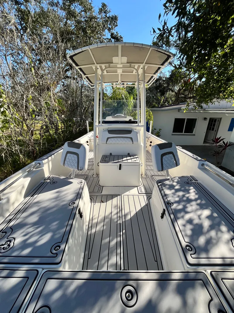 Slide: The Image of 2019 World Cat 230 CC boat with spacious deck and seating. - 17