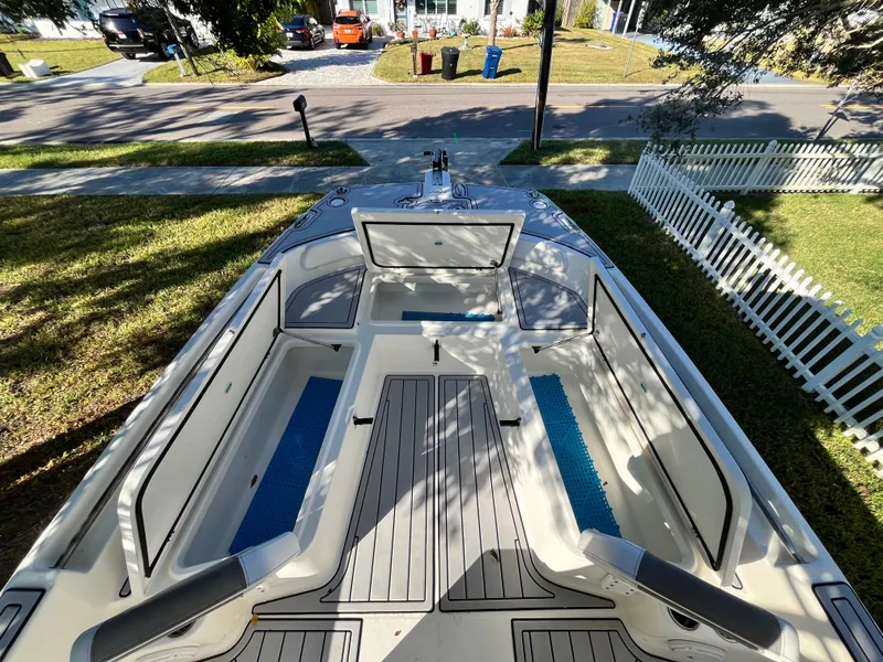 Slide: The Image of 2019 World Cat 230 CC boat, bow deck view outdoors. - 18