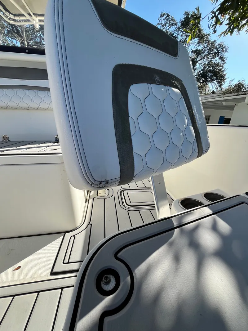 Slide: The Image of Interior of a 2019 World Cat 230 CC boat with seat upholstery. - 21