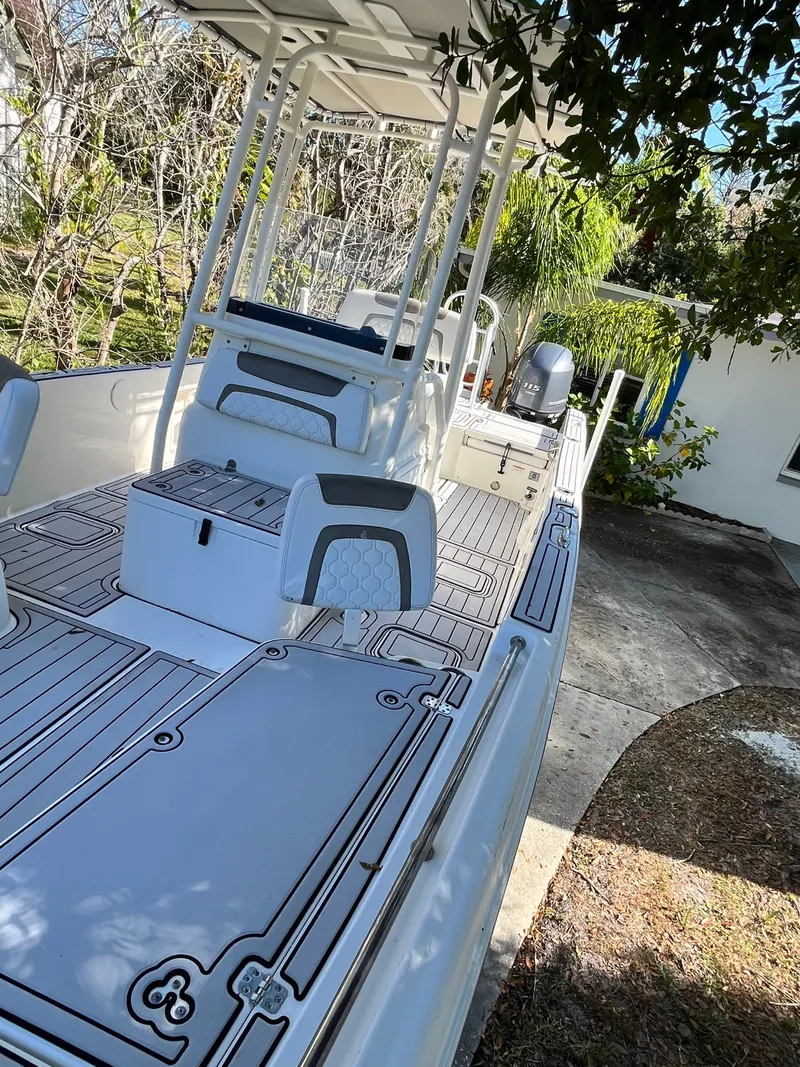 Slide: The Image of 2019 World Cat 230 CC boat with spacious deck and seating. - 22